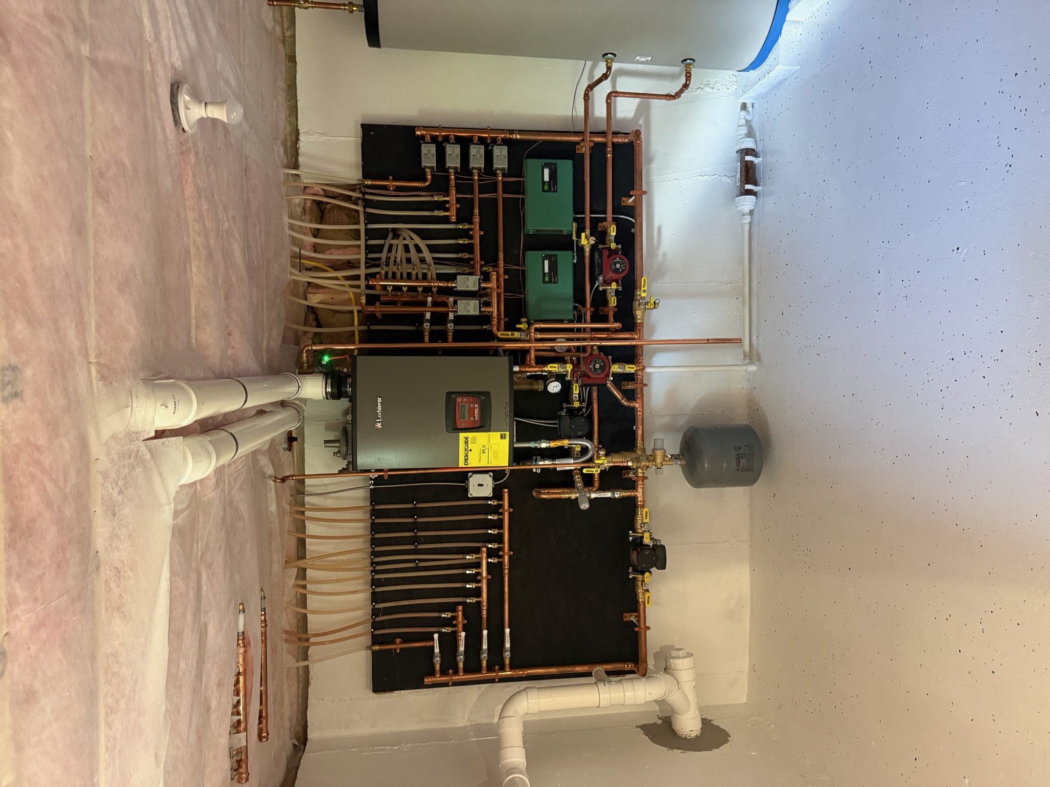 Heating system installation with copper piping and hot water storage tank